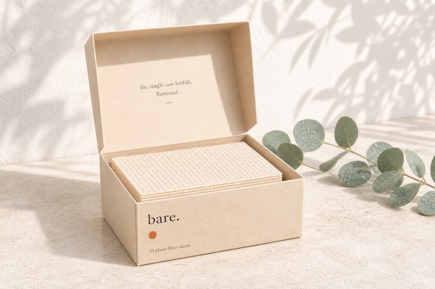 bare. the fifty — cream kraft box holding a flat stack of 50 plant-fiber sheets